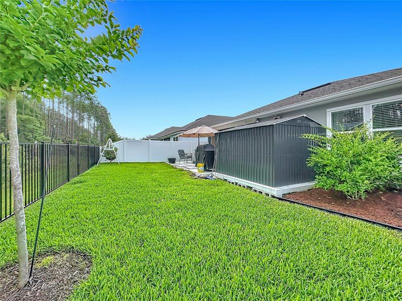 Exterior details and patio area of a home in Sawmill Branch Express, Palm Coast (Image 23).
