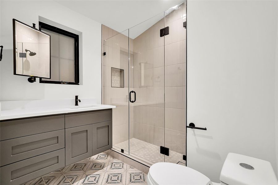 Bathroom featuring vanity and a stall shower Bathroom featuring vanity and a stall shower