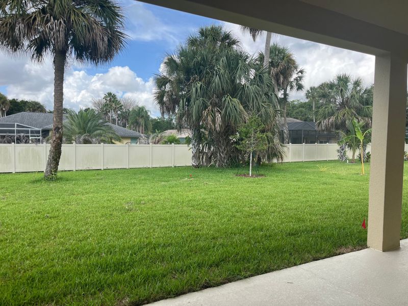 Exterior details and patio area of a home in Country Club Estates, Palm Bay (Image 3).