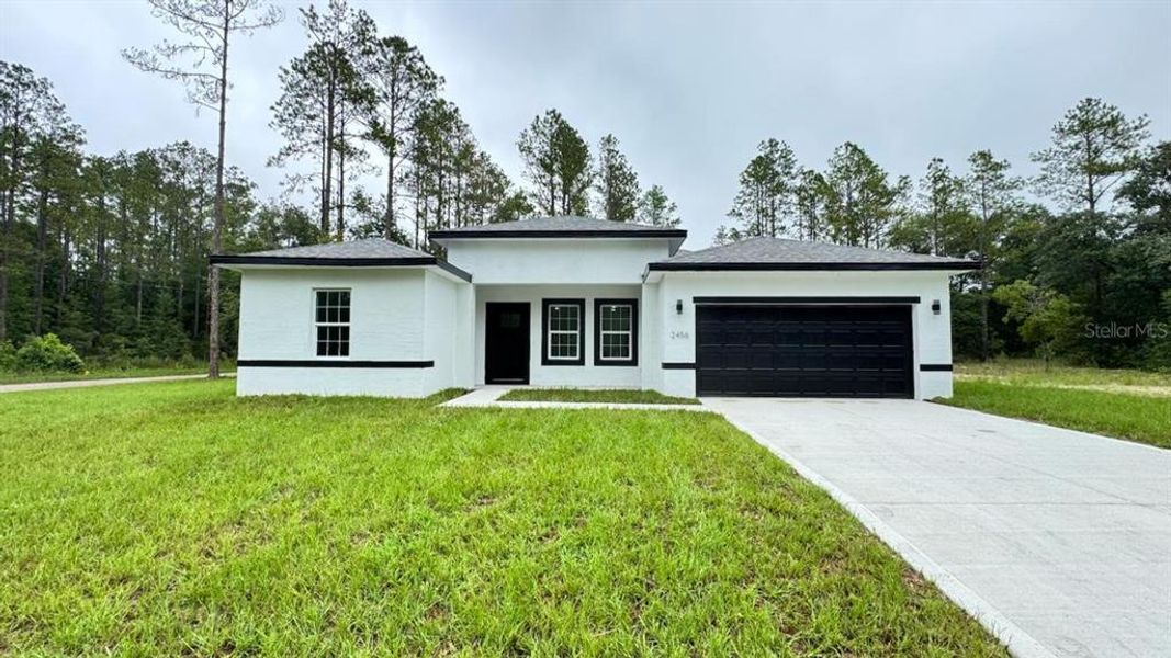 Front exterior of a new home in , Citrus Springs, FL, highlighting curb appeal (Image 16).