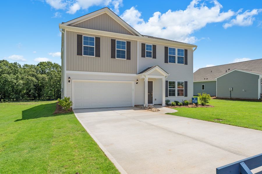 Front exterior of a new home in Burke Estates, Chesnee, SC, highlighting curb appeal (Image 2). Front exterior of a new home in Burke Estates, Chesnee, SC, highlighting curb appeal (Image 2).