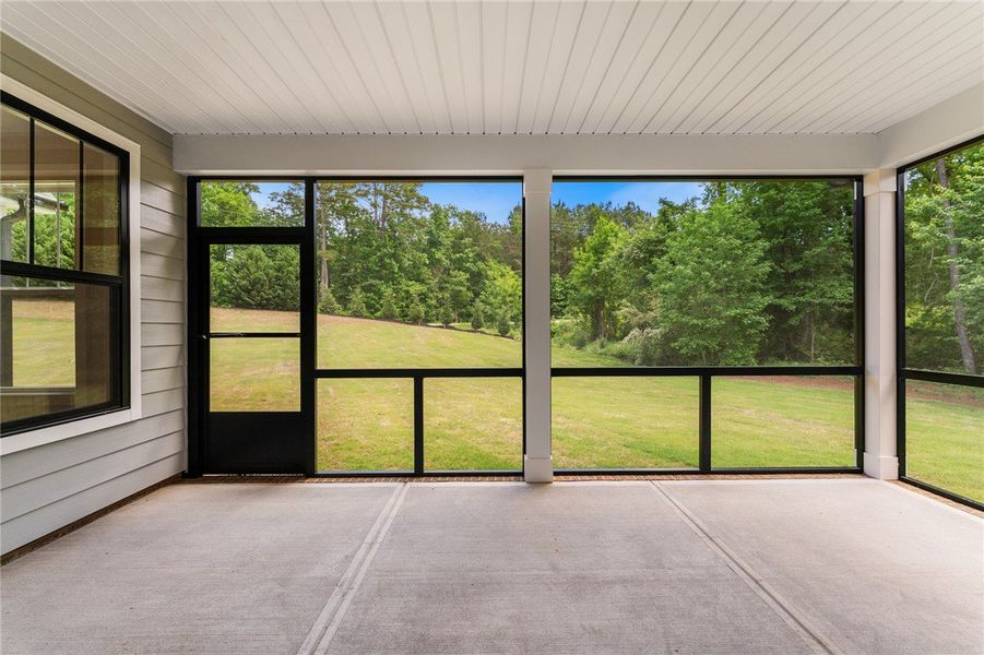 Enjoy nature's panorama from this screened porch,