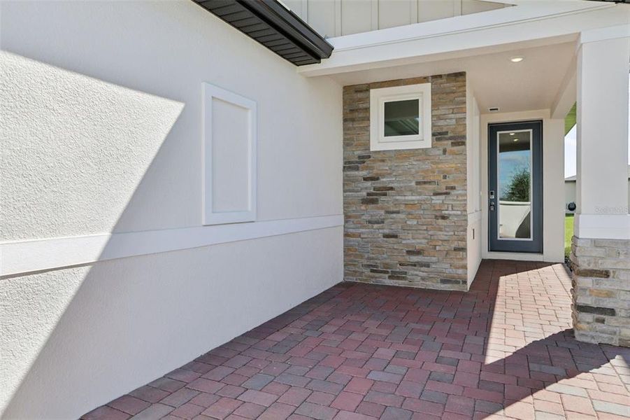 Exterior details and patio area of a home in Springs at Lake Alfred - Classic Series, Lake Alfred (Image 3).