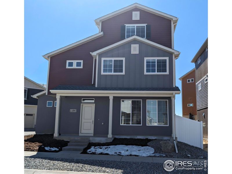 Front exterior of a new home in Thompson River Ranch, Johnstown, CO, highlighting curb appeal (Image 1). Front exterior of a new home in Thompson River Ranch, Johnstown, CO, highlighting curb appeal (Image 1).