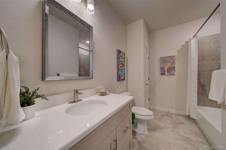 Bathroom two has a combo tub/shower and linen closet.