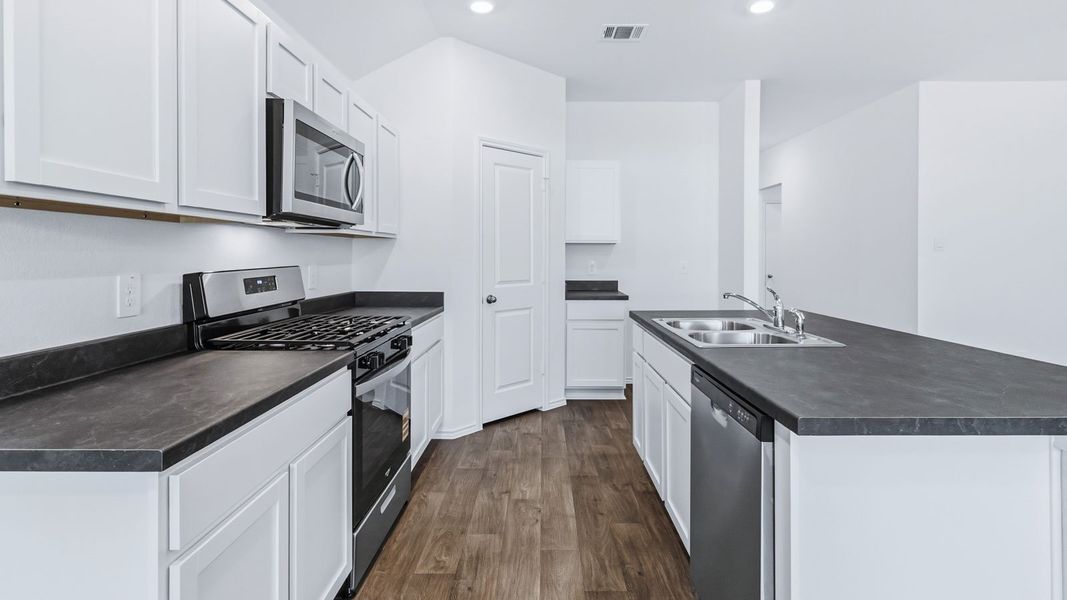 Representative furnished interior of a home built from the The Easton by D.R. Horton in Wayside, Uhland (Image 12).