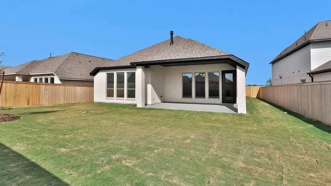Exterior details and patio area of a home in Bridgeland, Cypress (Image 4).