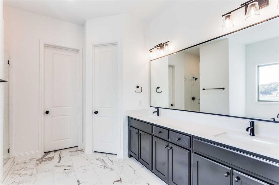 Bathroom with vanity and an enclosed shower