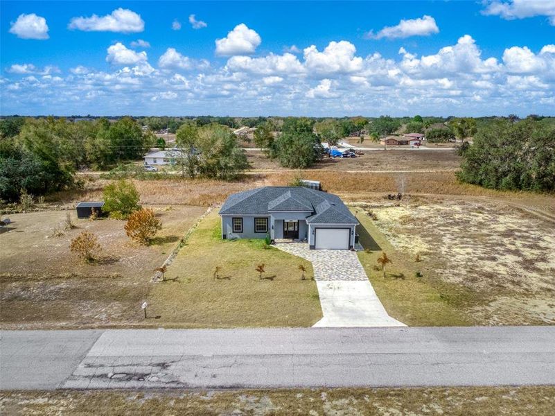 Front exterior of a new home in , Avon Park, FL, highlighting curb appeal (Image 29).