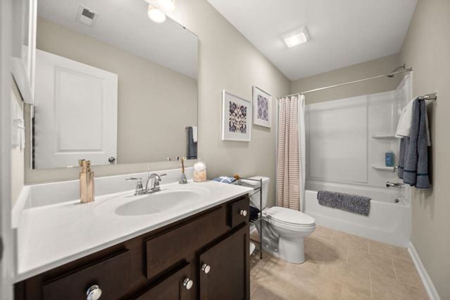 Representative furnished interior of a home built from the Kipling by True Homes in Whispering Hills, Locust (Image 19).