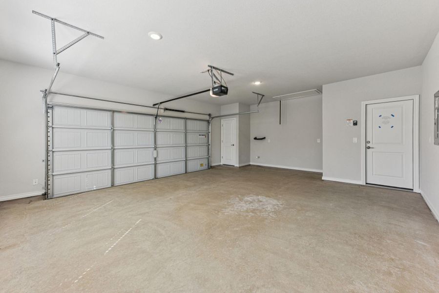 Garage with recessed lighting and a garage door opener Garage with recessed lighting and a garage door opener