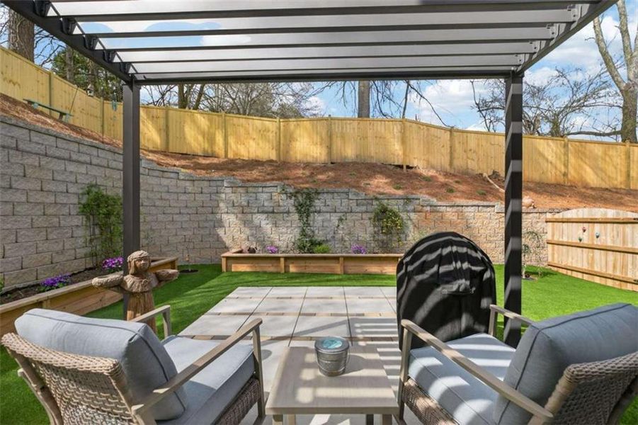Exterior details and patio area of a home in The Village at Towne Lake, Woodstock (Image 4).