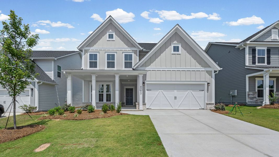 Front exterior of a new home in Hunters Creek, Flowery Branch, GA, highlighting curb appeal (Image 24). Front exterior of a new home in Hunters Creek, Flowery Branch, GA, highlighting curb appeal (Image 24).