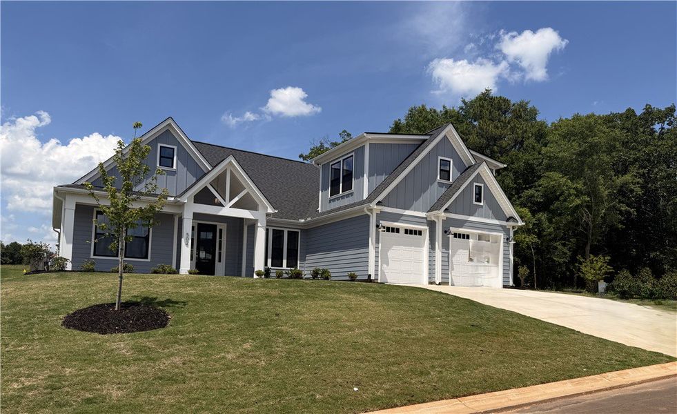Front exterior of a new home in Walker's Pointe, Anderson, SC, highlighting curb appeal (Image 2). Front exterior of a new home in Walker's Pointe, Anderson, SC, highlighting curb appeal (Image 2).