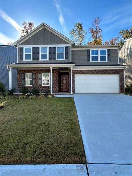 Front exterior of a new home in Wildwood at Avalon, McDonough, GA, highlighting curb appeal (Image 2).