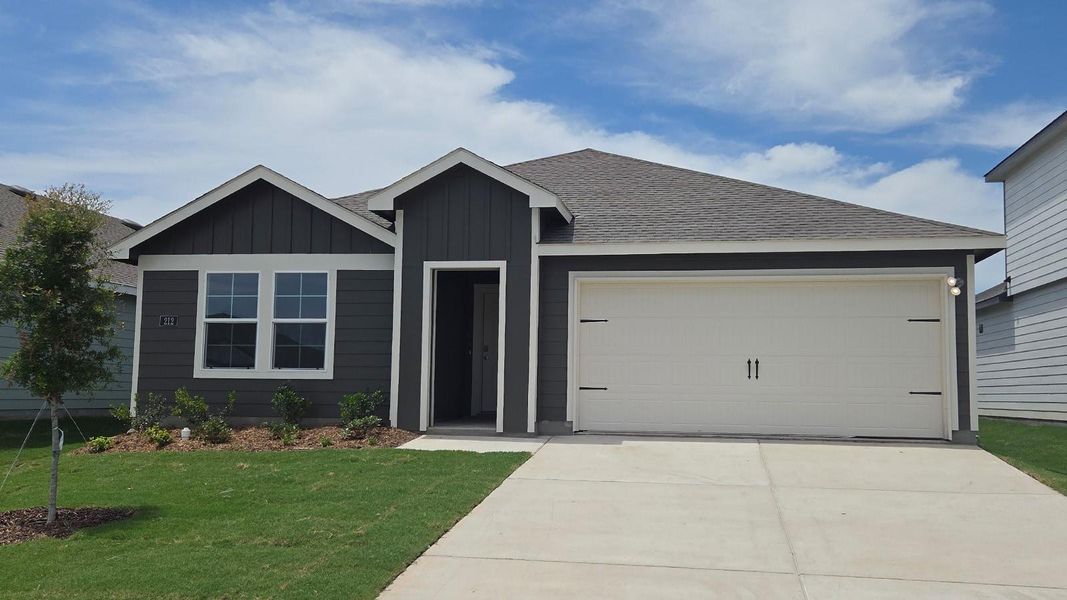 Front exterior of a new home in Wildwood, Royse City, TX, highlighting curb appeal (Image 1). Front exterior of a new home in Wildwood, Royse City, TX, highlighting curb appeal (Image 1).