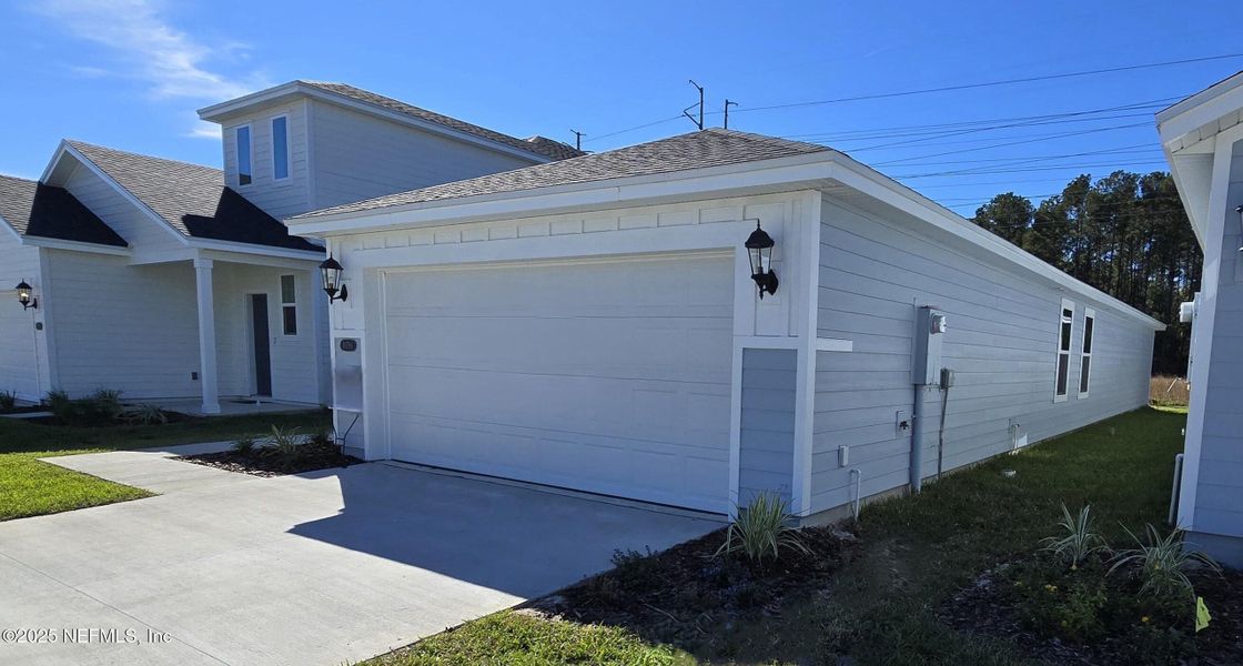 Front exterior of a new home in Kings Preserve, Jacksonville, FL, highlighting curb appeal (Image 19). Front exterior of a new home in Kings Preserve, Jacksonville, FL, highlighting curb appeal (Image 19).