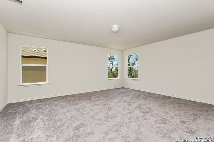 Spacious, unfurnished interior of a new home in Hidden Bluffs at TRP, San Antonio (Image 7).