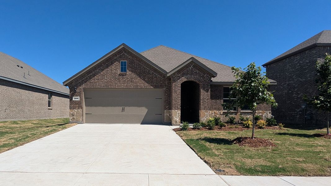 Front exterior of a new home in Trailstone, Caddo Mills, TX, highlighting curb appeal (Image 2). Front exterior of a new home in Trailstone, Caddo Mills, TX, highlighting curb appeal (Image 2).