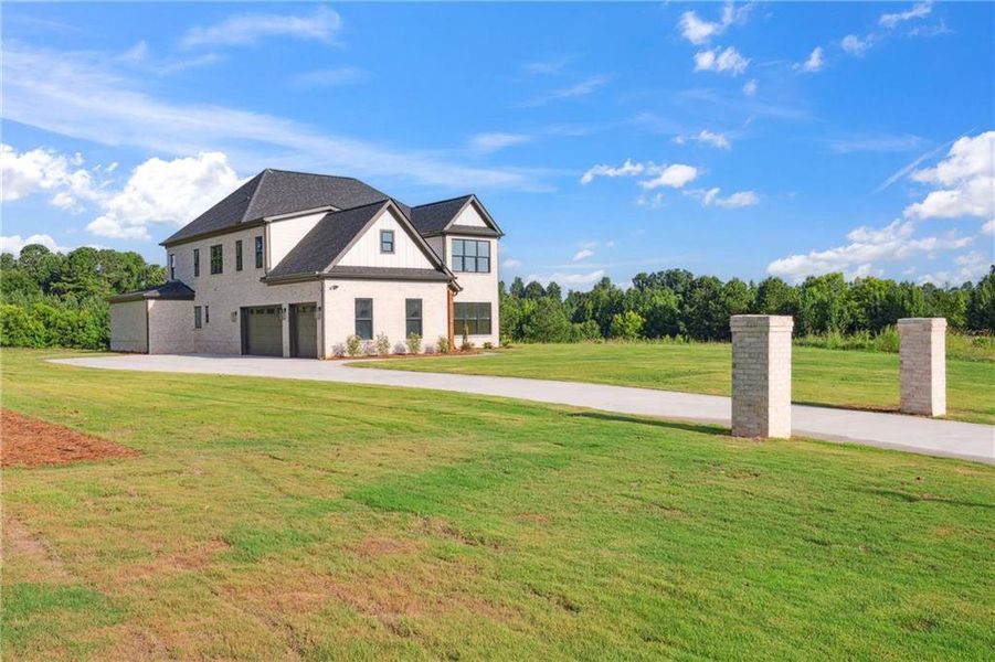 Front exterior of a new home in , Jefferson, GA, highlighting curb appeal (Image 29).