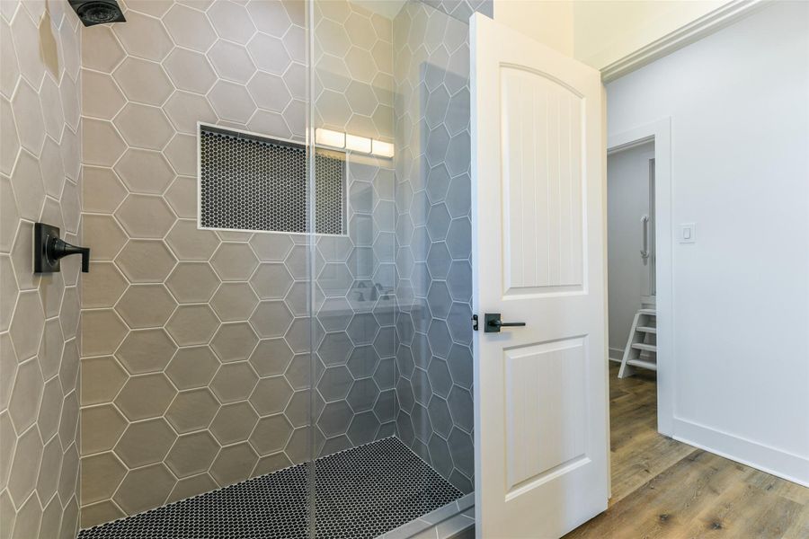 Second bath has an elegant shower with glass door Second bath has an elegant shower with glass door
