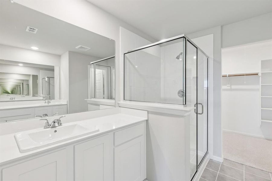 Primary Bathroom in the Harrison home plan by Trophy Signature Homes – REPRESENTATIVE PHOTO Primary Bathroom in the Harrison home plan by Trophy Signature Homes – REPRESENTATIVE PHOTO