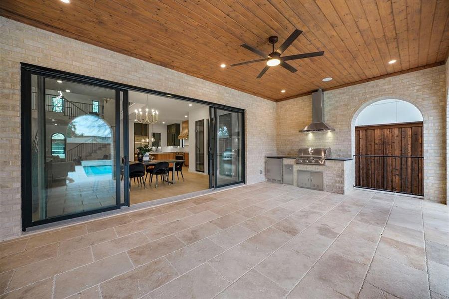 View of patio / terrace with area for grilling and a ceiling fan View of patio / terrace with area for grilling and a ceiling fan