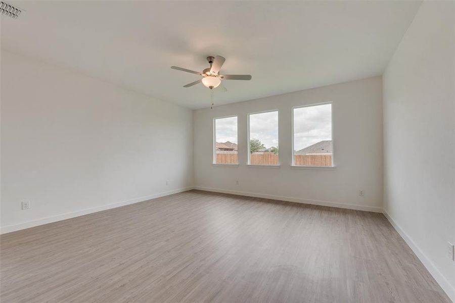 Unfurnished room featuring light hardwood / wood-style flooring and ceiling fan