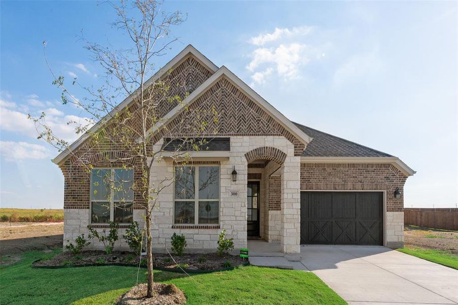 Front exterior of a new home in Arbors at Legacy Hills, Celina, TX, highlighting curb appeal (Image 2).