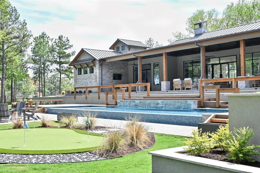 The fire pit and putting green completes this backyard oasis.