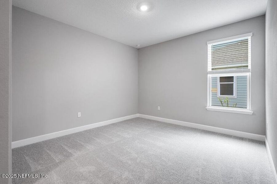 Spacious, unfurnished interior of a new home in Colbert Landings, Palm Coast (Image 18).