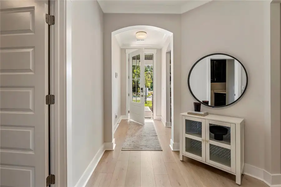 Step into this welcoming entryway, featuring warm Step into this welcoming entryway, featuring warm