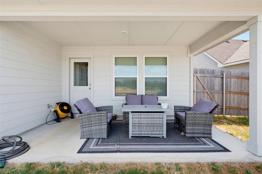 Sheltered outdoor living is made easy with this covered concrete back patio. Sheltered outdoor living is made easy with this covered concrete back patio.