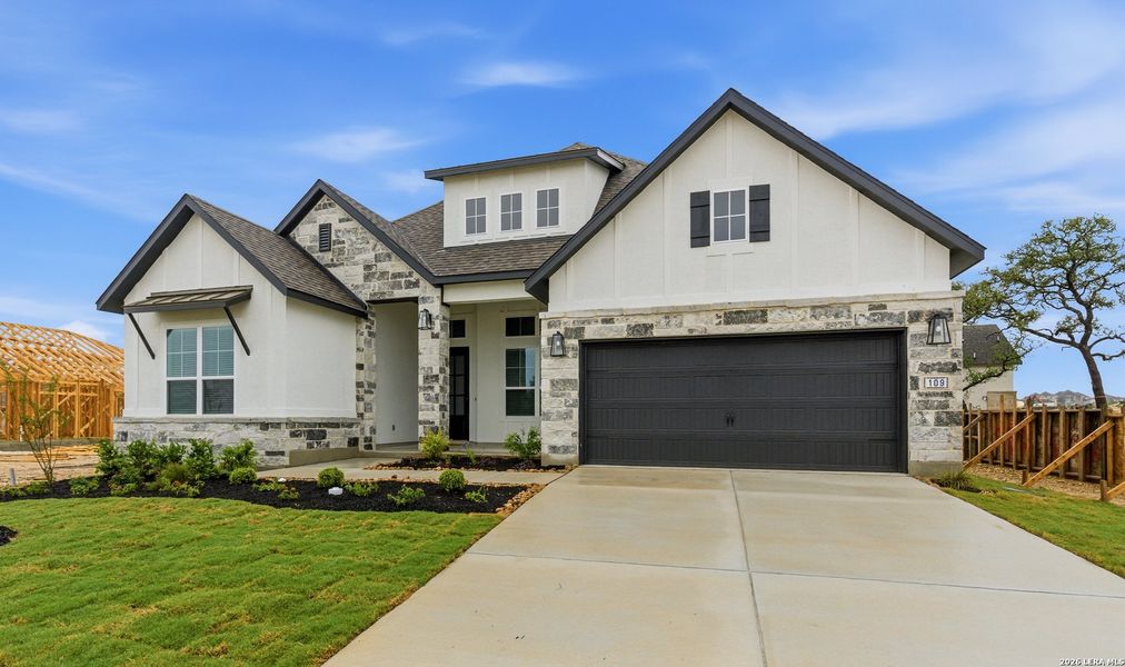 Front exterior of a new home in Esperanza 50's, Boerne, TX, highlighting curb appeal (Image 25). Front exterior of a new home in Esperanza 50's, Boerne, TX, highlighting curb appeal (Image 25).