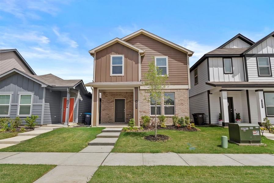 Front exterior of a new home in Orchard Village, Fort Worth, TX, highlighting curb appeal (Image 2). Front exterior of a new home in Orchard Village, Fort Worth, TX, highlighting curb appeal (Image 2).
