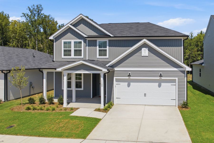 Front exterior of a new home in Carpenter Falls, Durham, NC, highlighting curb appeal (Image 27).