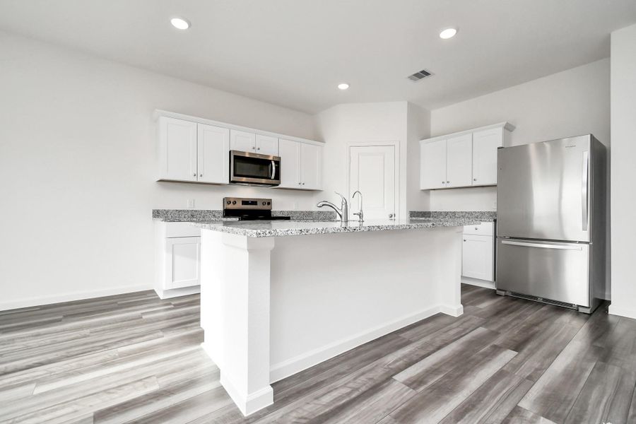 Furnished interior view inside a new home in Sunterra, Katy (Image 7).
