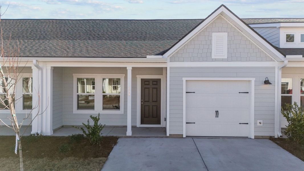 Exterior details and patio area of a home in Blue Heron Retreat: Villas, Little River (Image 3).
