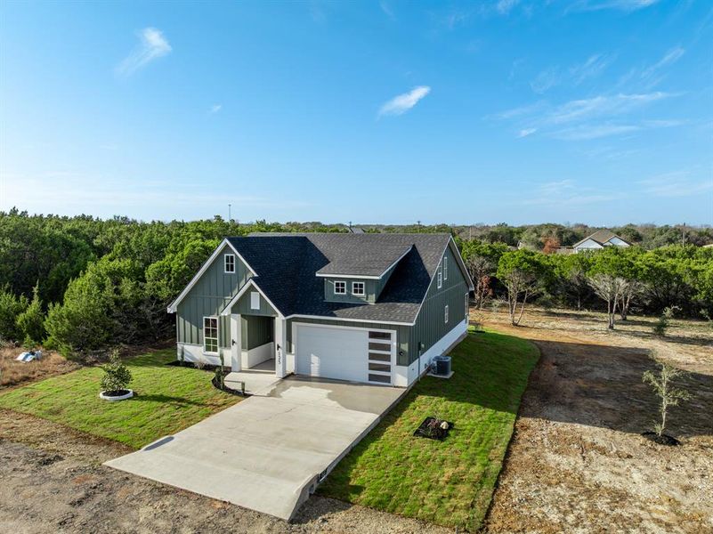 Front exterior of a new home in , Whitney, TX, highlighting curb appeal (Image 16). Front exterior of a new home in , Whitney, TX, highlighting curb appeal (Image 16).