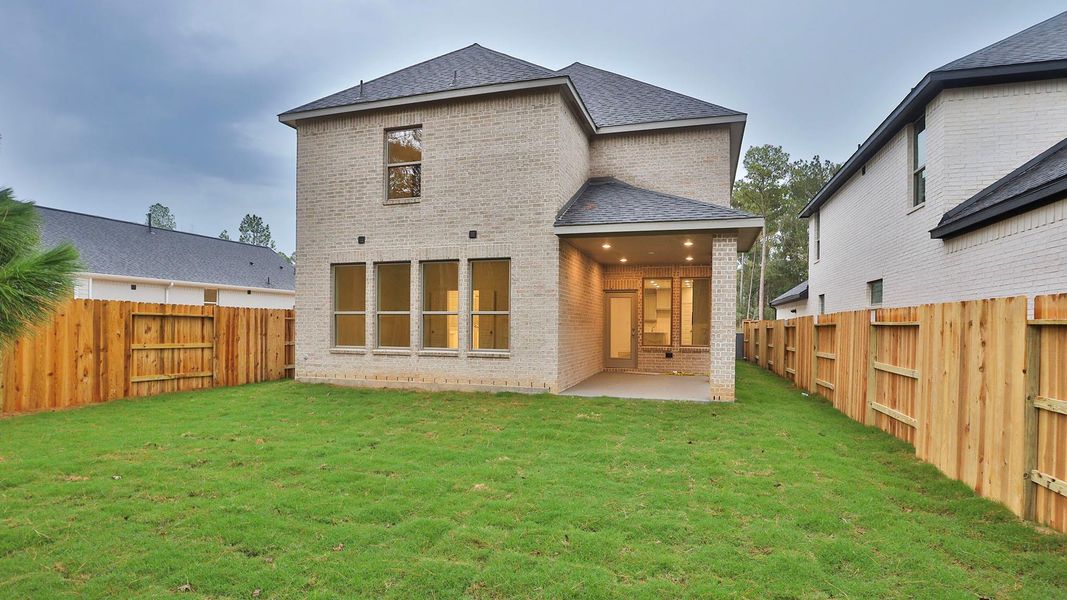 Exterior details and patio area of a home in , Magnolia (Image 3). Exterior details and patio area of a home in , Magnolia (Image 3).