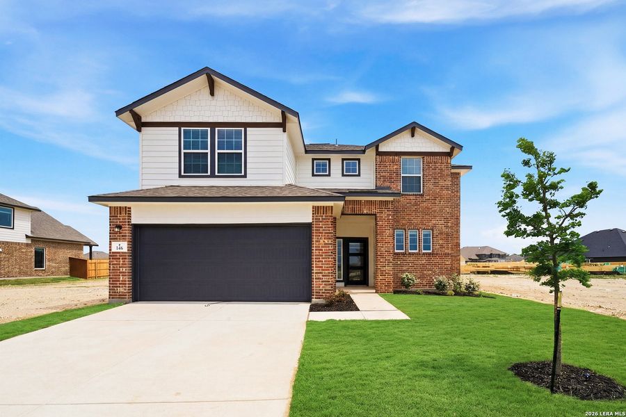 Front exterior of a new home in Megan's Landing, Castroville, TX, highlighting curb appeal (Image 2).