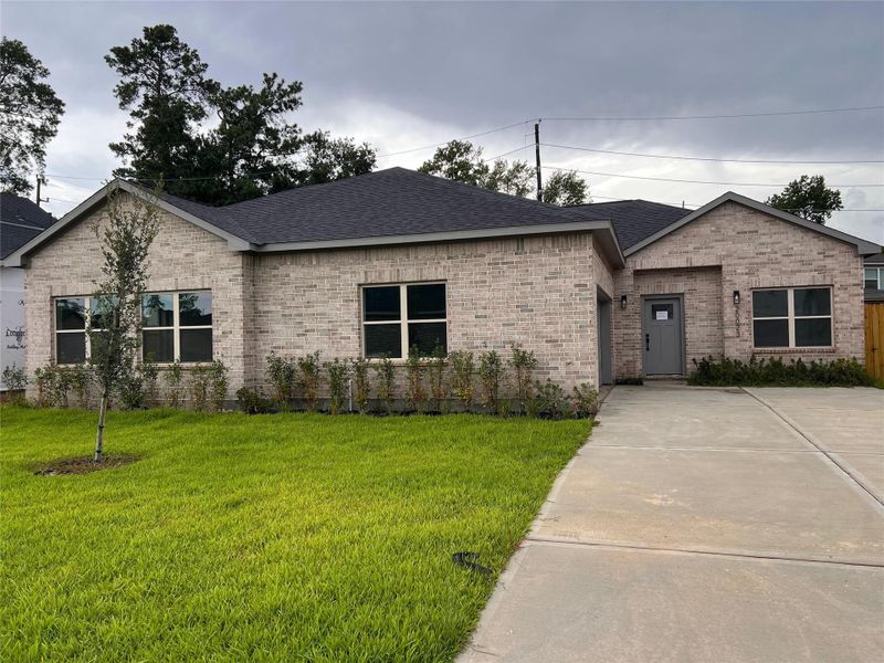 Front exterior of a new home in , Spring, TX, highlighting curb appeal (Image 1).