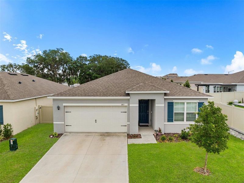 Front exterior of a new home in Cascades, Davenport, FL, highlighting curb appeal (Image 2). Front exterior of a new home in Cascades, Davenport, FL, highlighting curb appeal (Image 2).