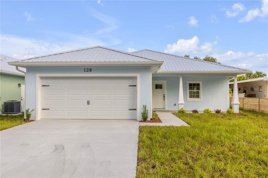 Front exterior of a new home in , Oak Hill, FL, highlighting curb appeal (Image 25).