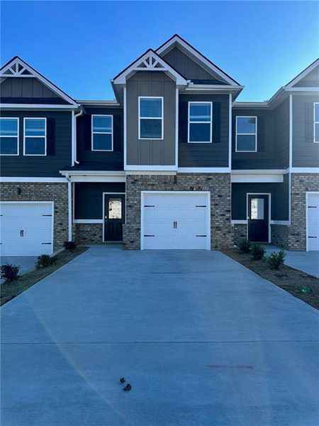 Front exterior of a new home in Azalea Hills, Temple, GA, highlighting curb appeal (Image 1). Front exterior of a new home in Azalea Hills, Temple, GA, highlighting curb appeal (Image 1).