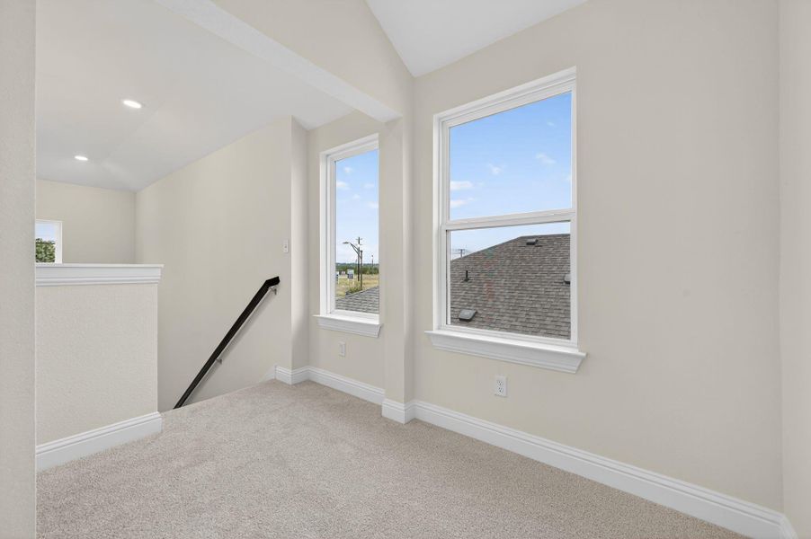Unfurnished room featuring carpet floors, healthy amount of natural light, and recessed lighting