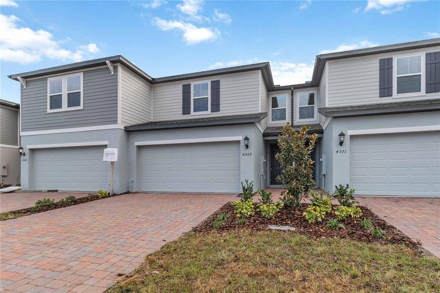 Front exterior of a new home in , St. Cloud, FL, highlighting curb appeal (Image 25).