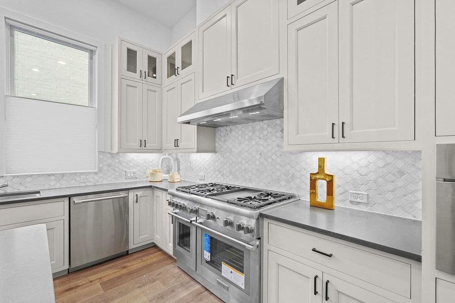 Thermador appliances, 48" gas range, double oven.