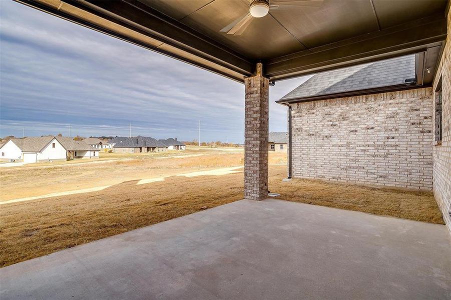 View of patio featuring ceiling fan