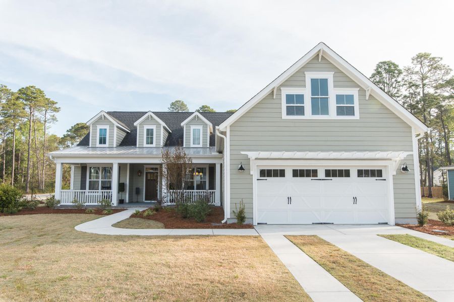 Representative exterior photo of a completed home built from the McKinley by Bill Clark Homes in The Sanctuary at Sunset Beach, Sunset Beach, NC (Image 27). Representative exterior photo of a completed home built from the McKinley by Bill Clark Homes in The Sanctuary at Sunset Beach, Sunset Beach, NC (Image 27).